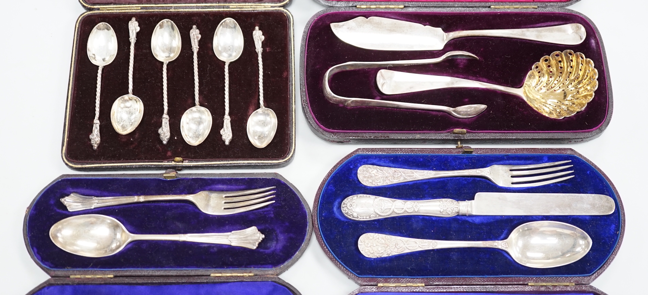 Four cased sets of silver cutlery including apostle spoons and christening sets.